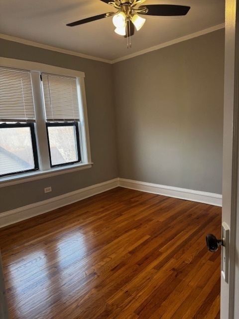 1614 North Harding Avenue, Unit 3E Chicago, IL 60647 - Photo 12 of 14 a view of an empty room with wooden floor and a window