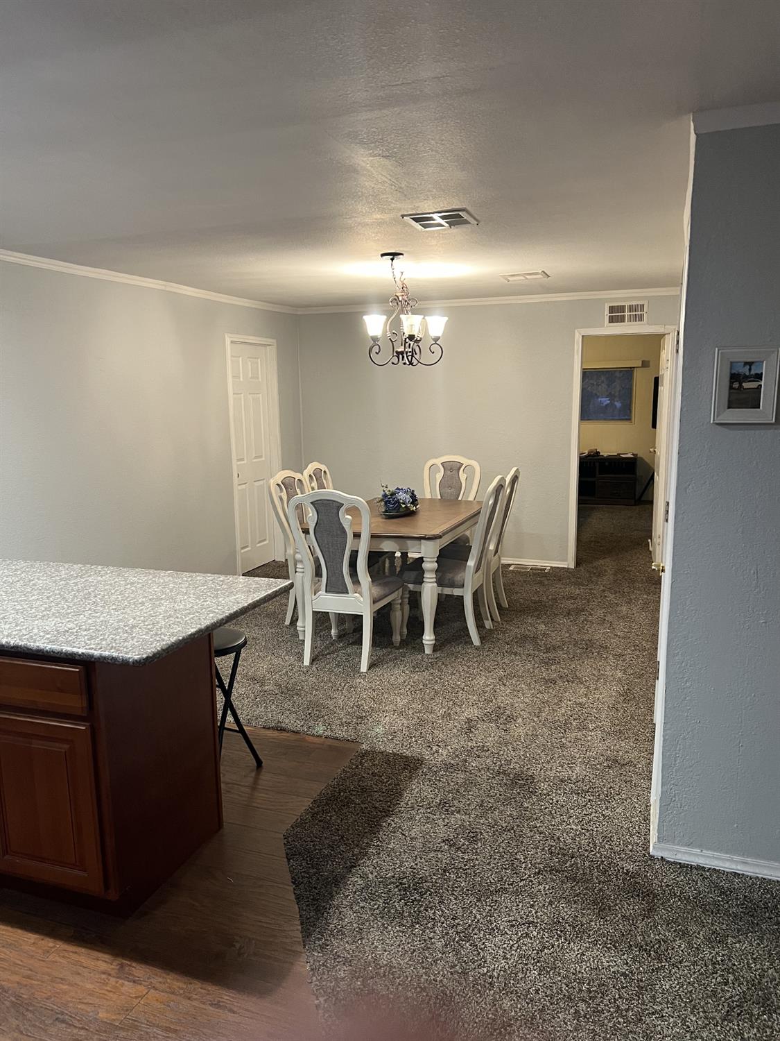 1218 East Cleveland Avenue, Unit 2 Madera, CA 93638 - Photo 4 of 8 a view of a dining room with furniture
