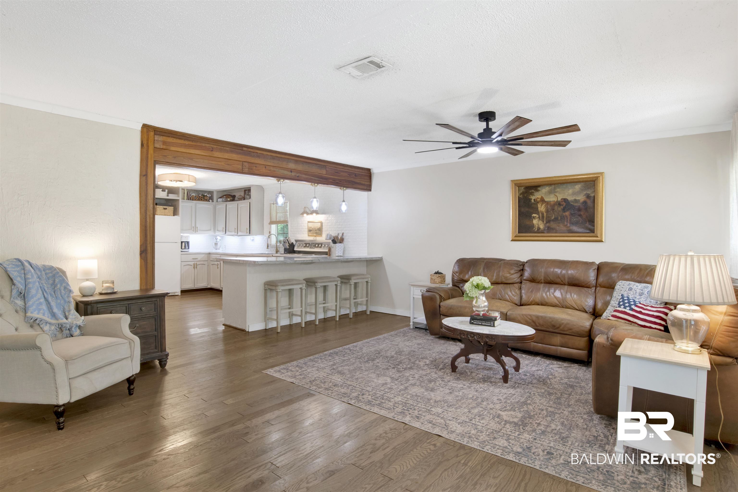 4265 Greaves Road Eight Mile, AL 36613 - Photo 6 of 34 Living area featuring dark wood-style flooring, a ceiling fan, and crown molding