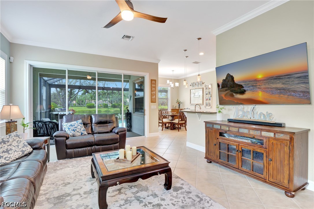 11230 Suffield Street Fort Myers, FL 33913 - Photo 6 of 42 a living room with furniture and a flat screen tv