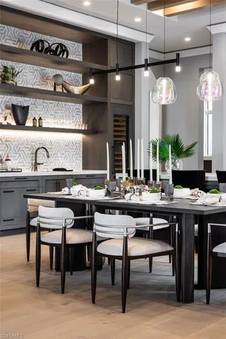 a kitchen with a table and chairs in it