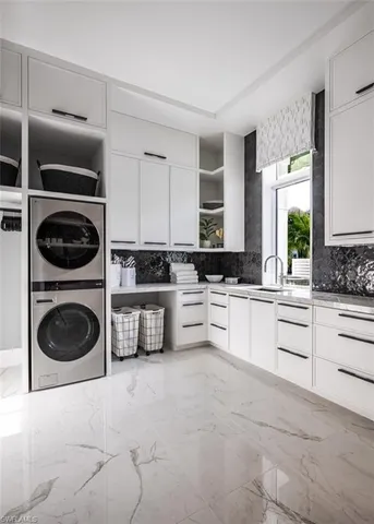 a view of a hallway with wooden floor and a bathroom