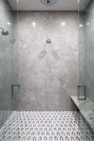 a living room with stainless steel appliances kitchen island granite countertop furniture and a large window