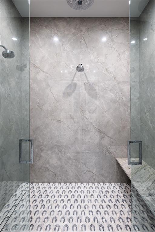 405 Neapolitan Way Naples, FL 34103 - Photo 21 of 50 a bathroom with a shower