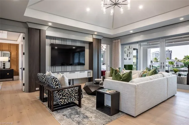 a kitchen with kitchen island granite countertop a table and chairs in it