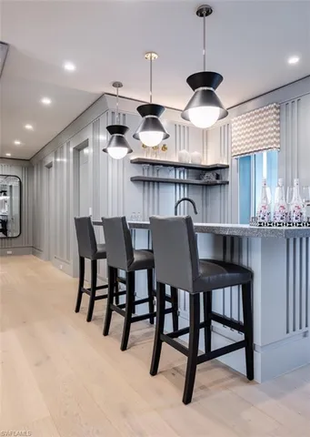 a kitchen with granite countertop a sink and cabinets