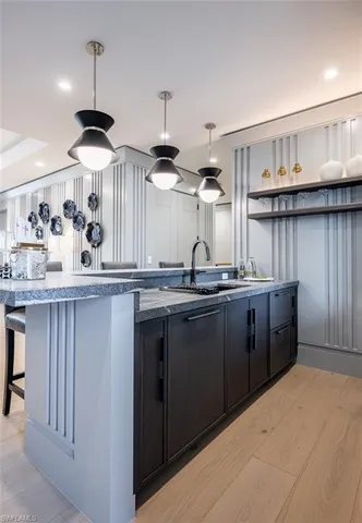 a kitchen with a sink and a refrigerator