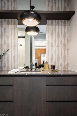 a bathroom with a sink a toilet and a shower