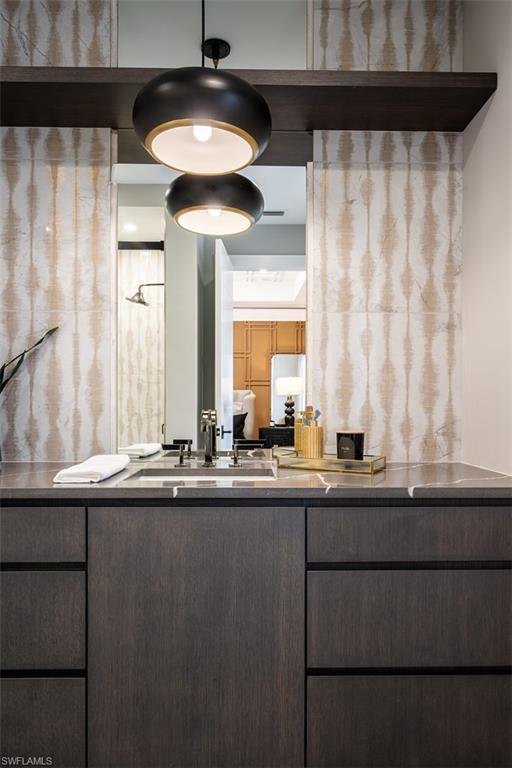 405 Neapolitan Way Naples, FL 34103 - Photo 32 of 50 a kitchen with a sink and a refrigerator