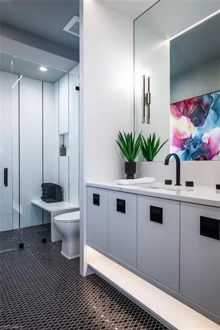 a kitchen with stainless steel appliances a sink stove and cabinets