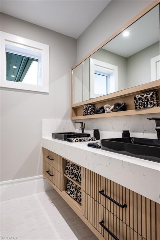 405 Neapolitan Way Naples, FL 34103 - Photo 36 of 50 a kitchen with stainless steel appliances a sink stove and cabinets