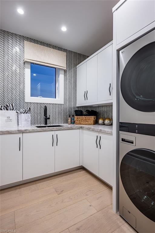 405 Neapolitan Way Naples, FL 34103 - Photo 38 of 50 a kitchen with white cabinets and sink