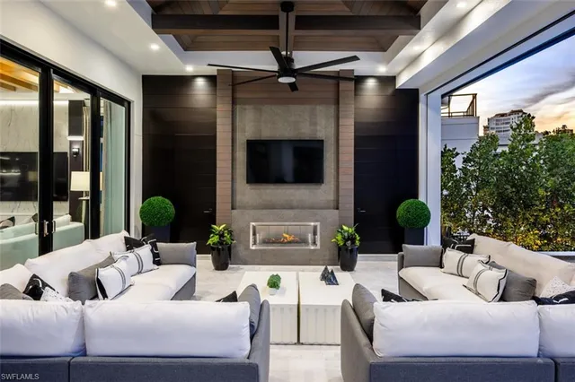 a view of a house with pool and chairs