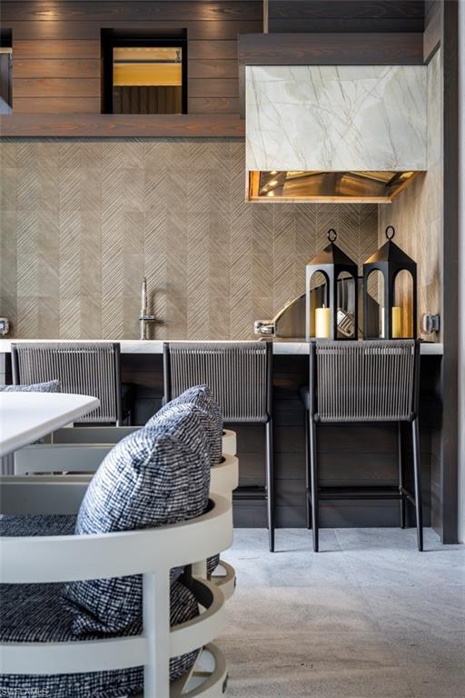 405 Neapolitan Way Naples, FL 34103 - Photo 47 of 50 a bedroom with a bed and a dresser