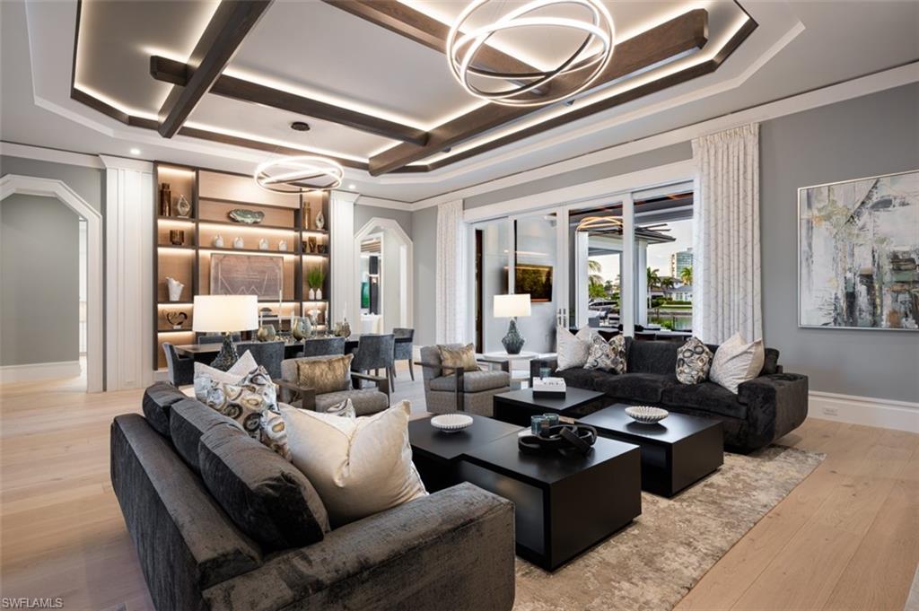 405 Neapolitan Way Naples, FL 34103 - Photo 6 of 50 a living room with furniture