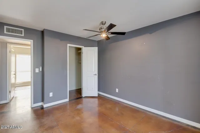 wooden floor in an empty room and a window