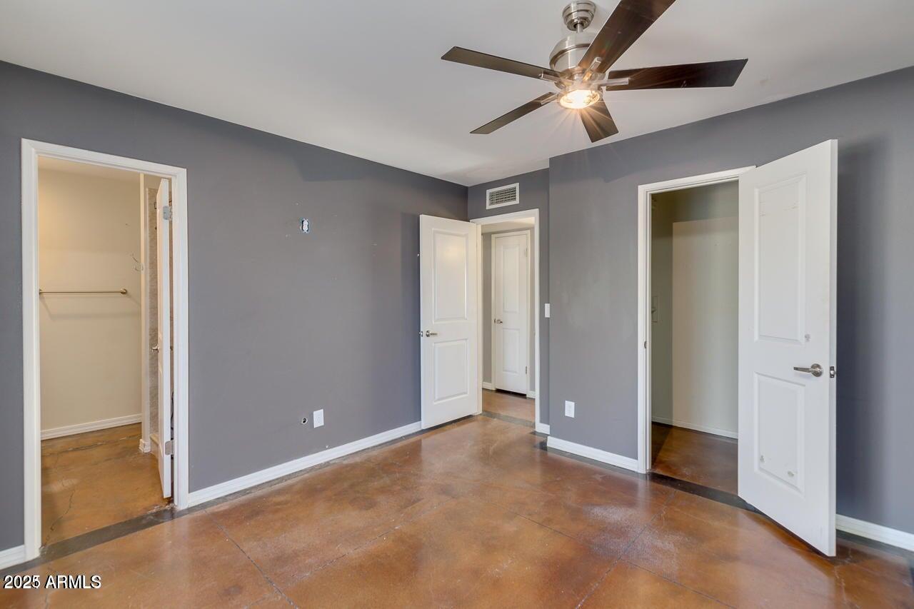 3832 East Bloomfield Road Phoenix, AZ 85032 - Photo 17 of 32 a view of an empty room with a ceiling fan