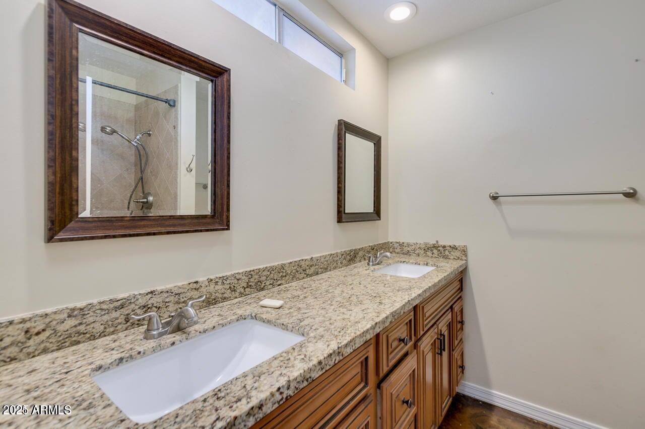 3832 East Bloomfield Road Phoenix, AZ 85032 - Photo 19 of 32 a bathroom with a granite countertop sink and a mirror