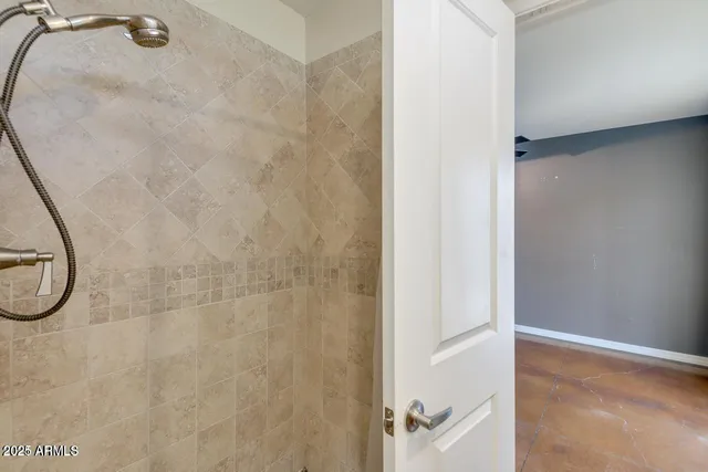 a bathroom with a glass shower door