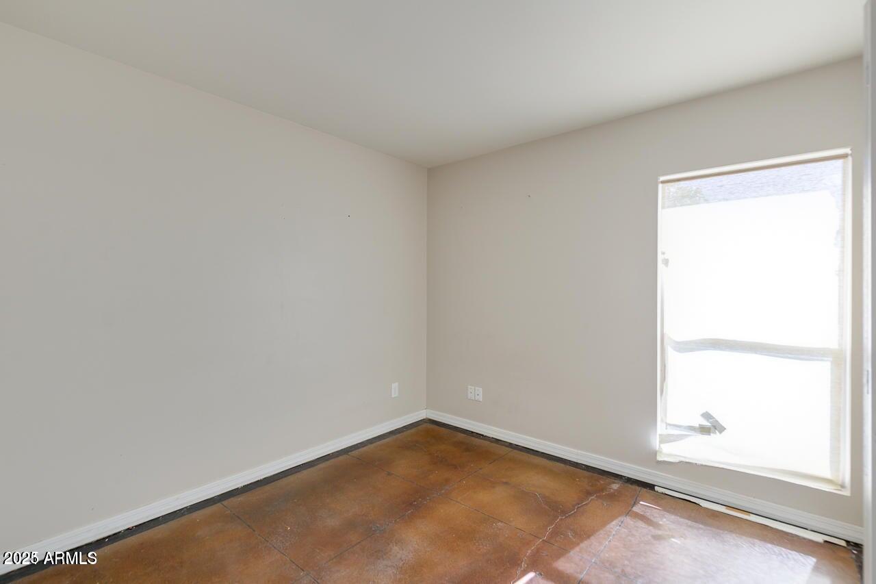 3832 East Bloomfield Road Phoenix, AZ 85032 - Photo 24 of 32 an empty room with a window