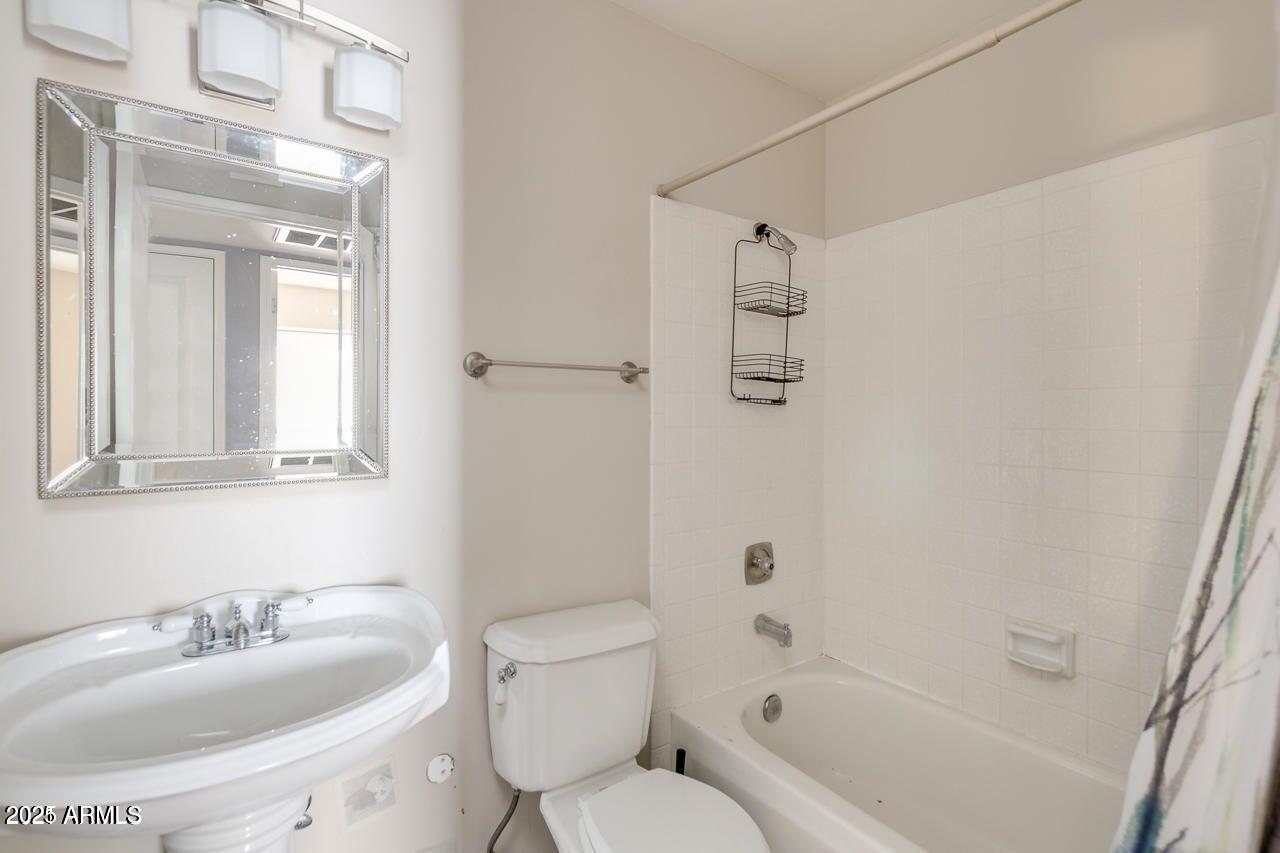 3832 East Bloomfield Road Phoenix, AZ 85032 - Photo 25 of 32 a bathroom with a sink toilet and shower