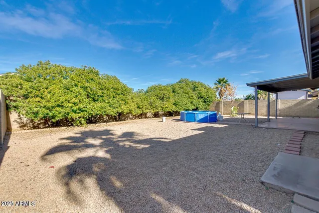 a view of a street with a building in the background