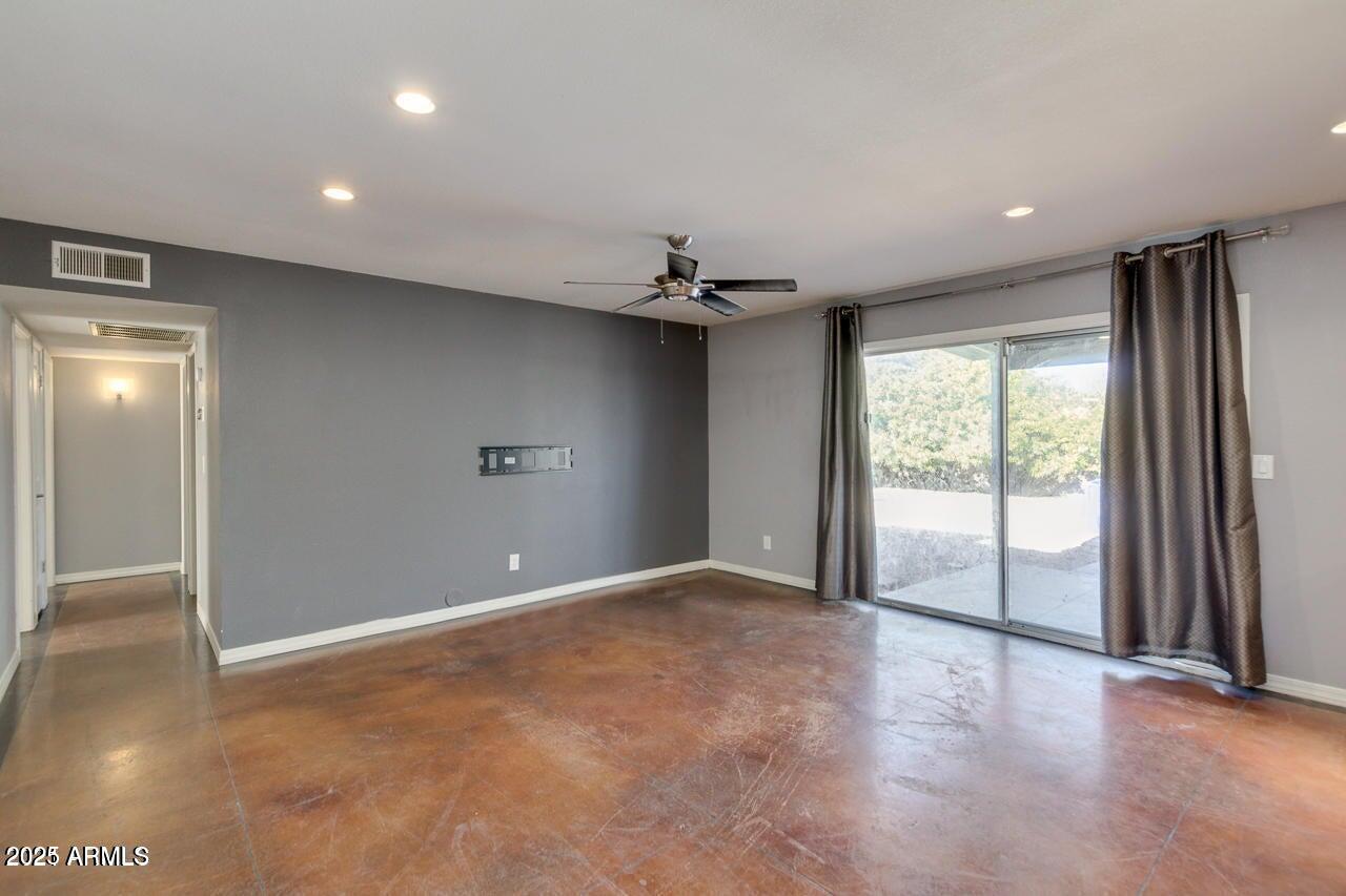 3832 East Bloomfield Road Phoenix, AZ 85032 - Photo 3 of 32 a view of a livingroom with a ceiling fan and window