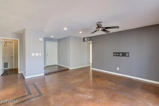 a view of an empty room and window