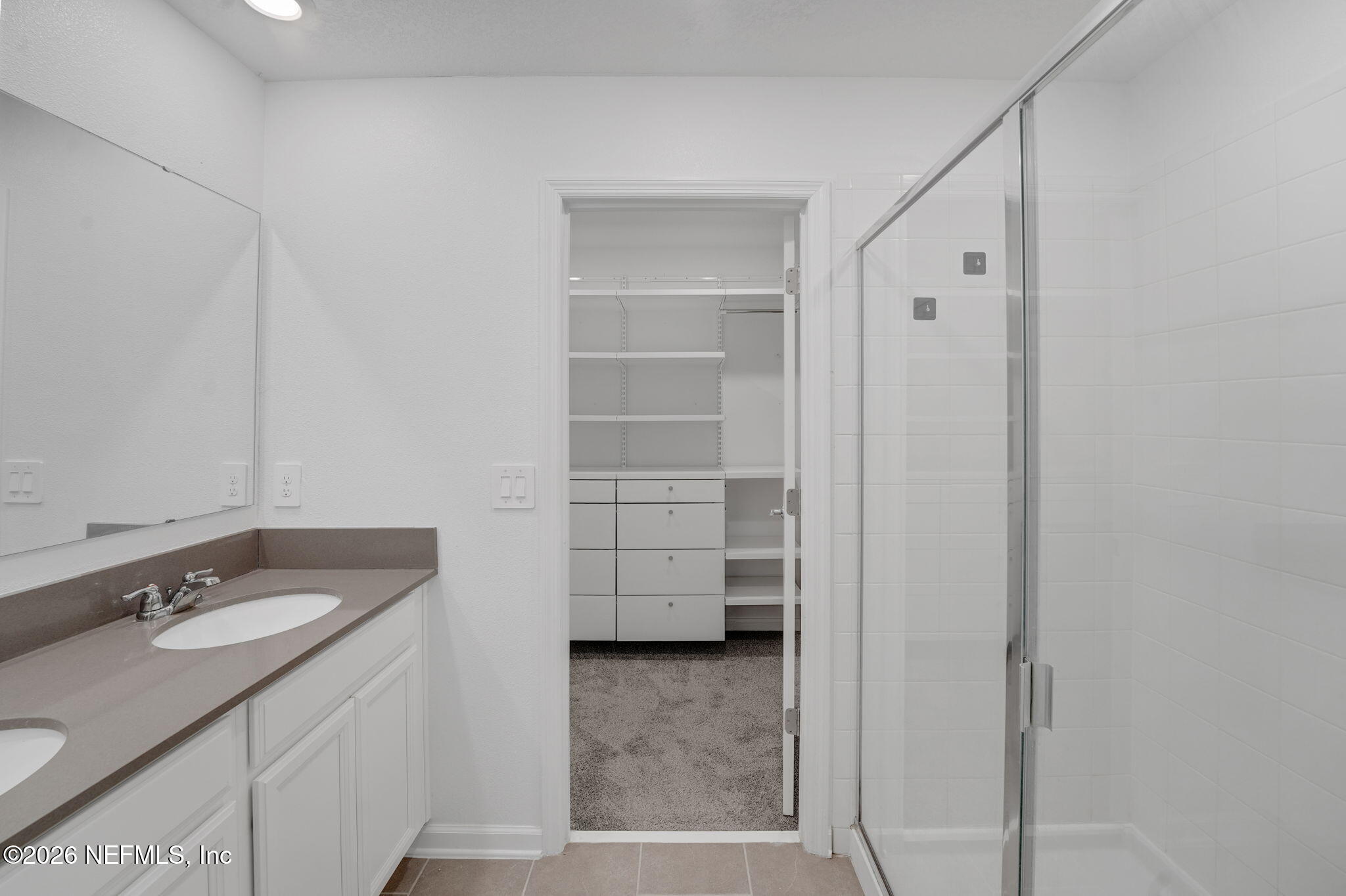 1214 Fury Street Davenport, FL 33837 - Photo 12 of 37 a bathroom with a sink a vanity and mirror
