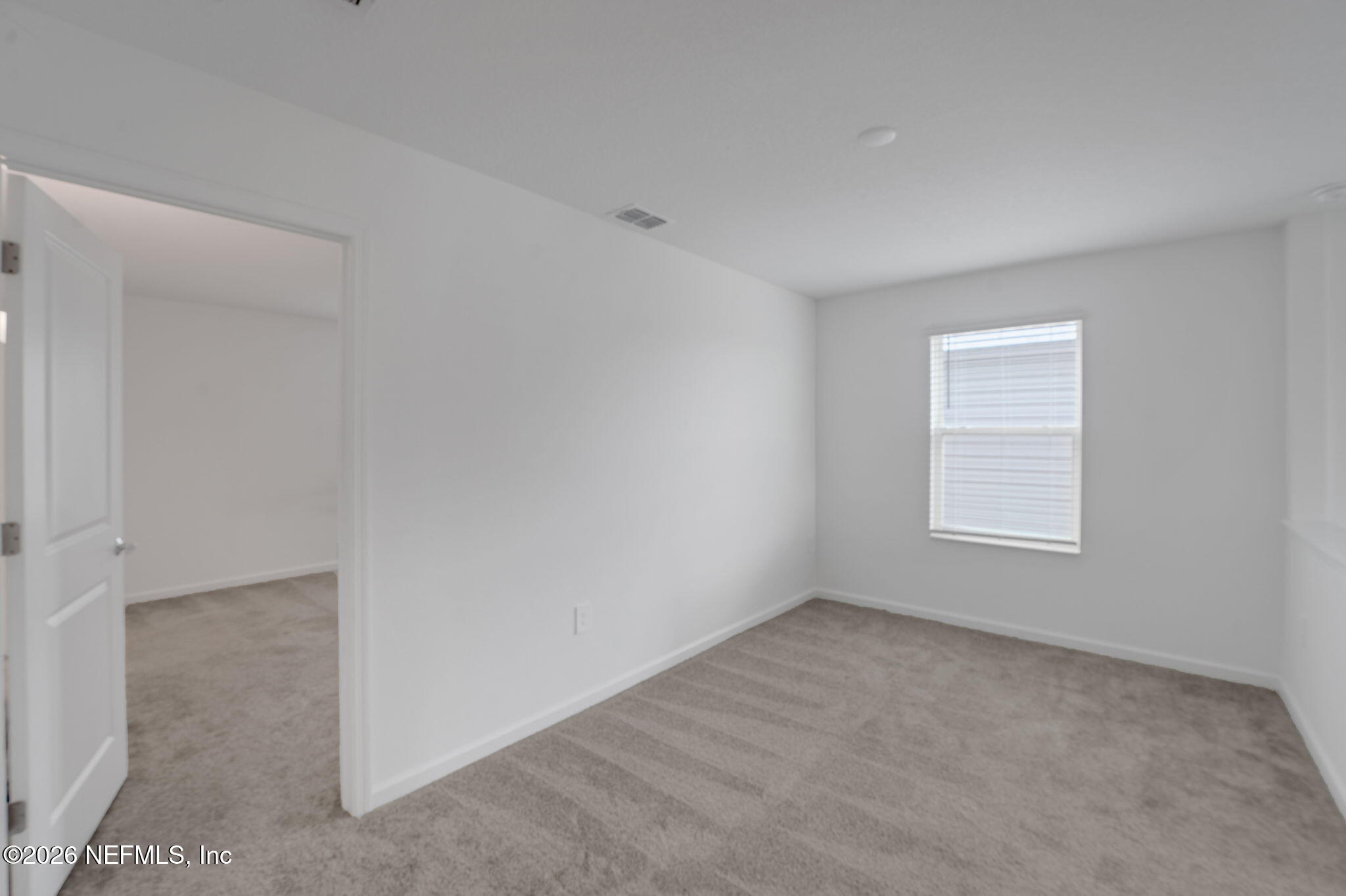 1214 Fury Street Davenport, FL 33837 - Photo 14 of 37 a view of an empty room with a window