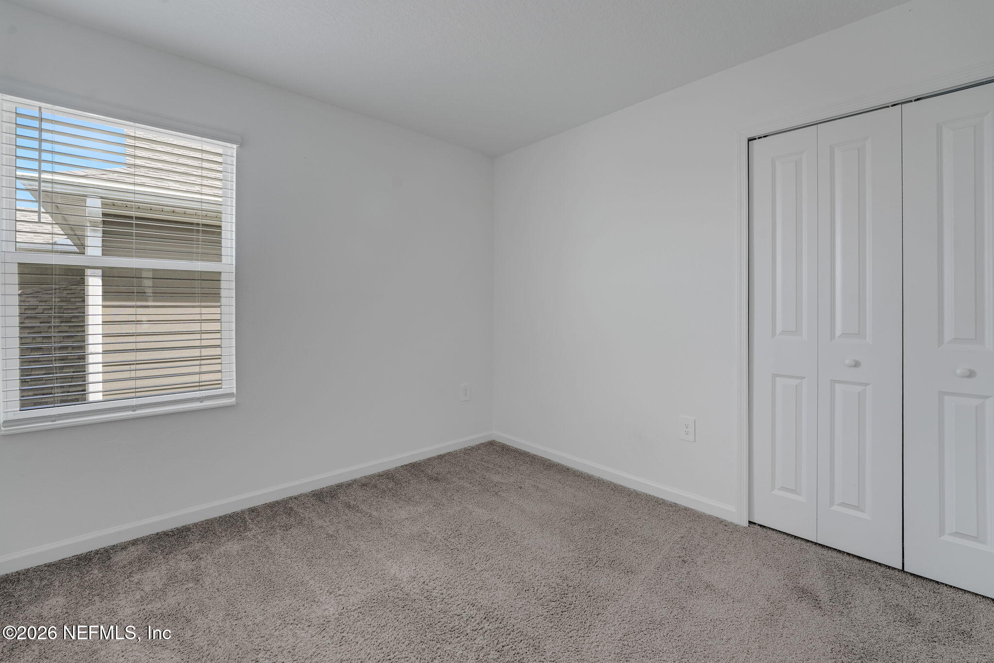 1214 Fury Street Davenport, FL 33837 - Photo 19 of 37 a view of an empty room with a window