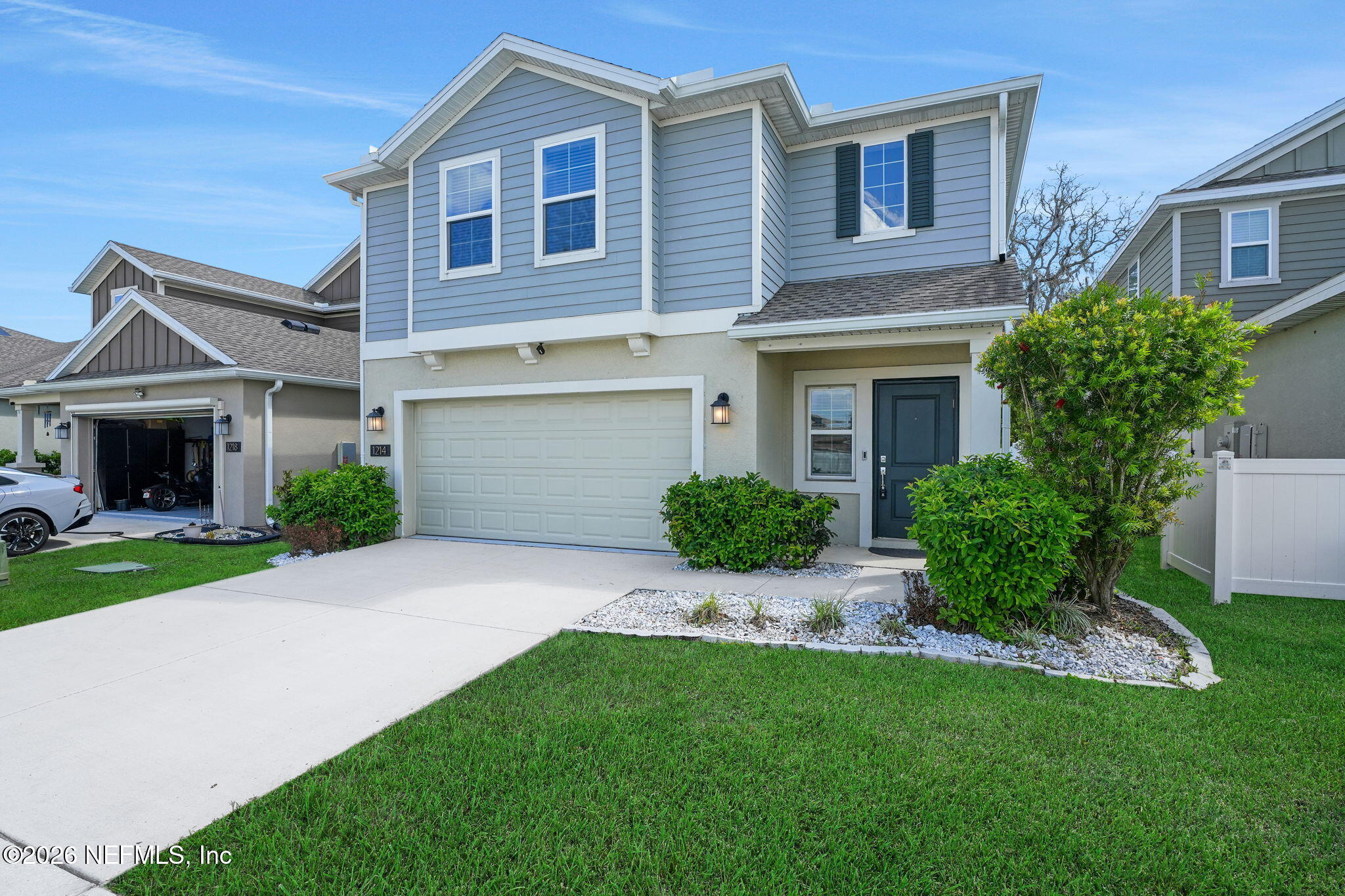 1214 Fury Street Davenport, FL 33837 - Photo 2 of 37 a front view of a house with a garden and yard