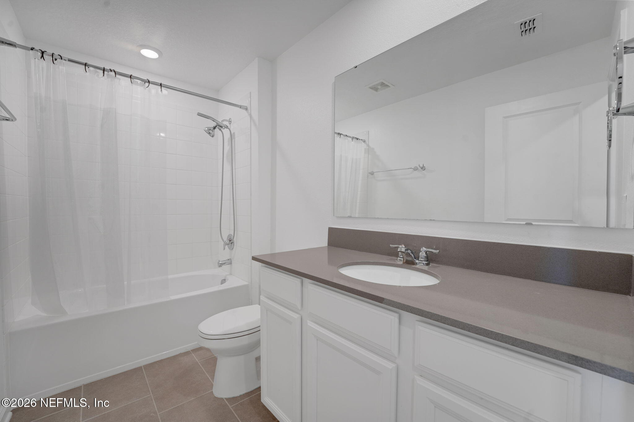 1214 Fury Street Davenport, FL 33837 - Photo 23 of 37 a bathroom with a granite countertop sink toilet and shower