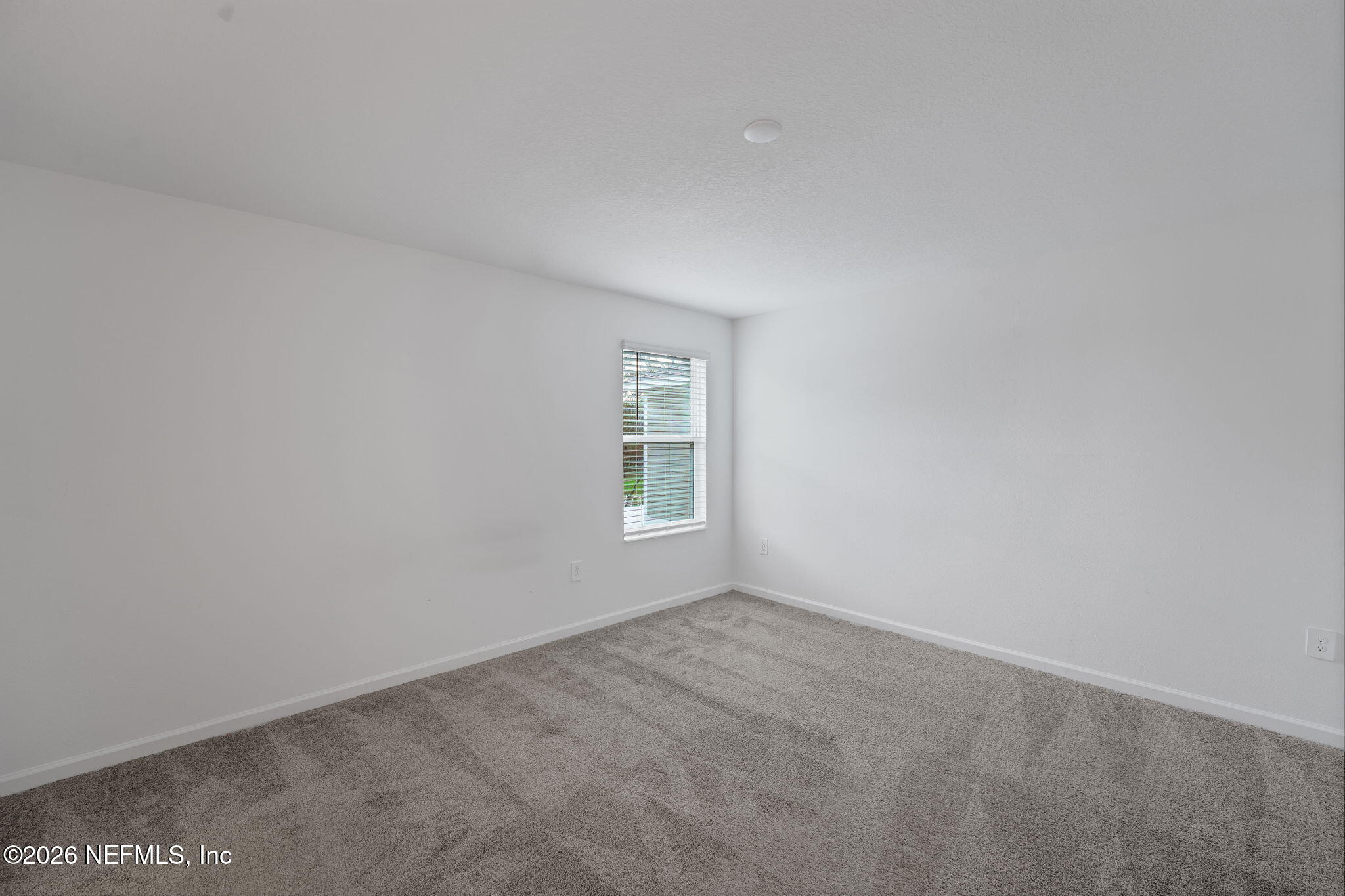 1214 Fury Street Davenport, FL 33837 - Photo 10 of 37 a view of an empty room with a window