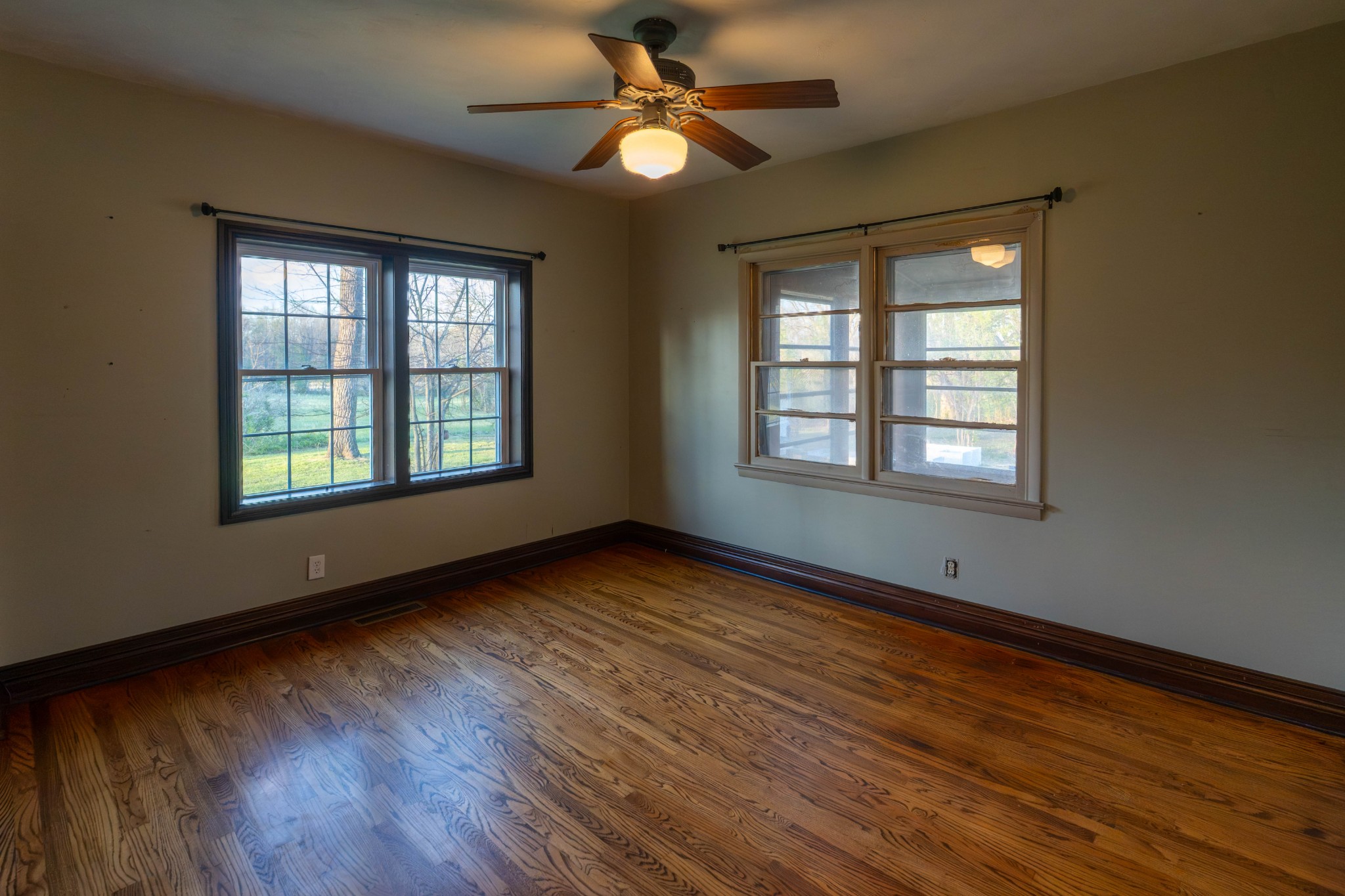 510 Rosebower Church Road Paducah, KY 42003 - Photo 25 of 52 a view of an empty room with wooden floor and a window