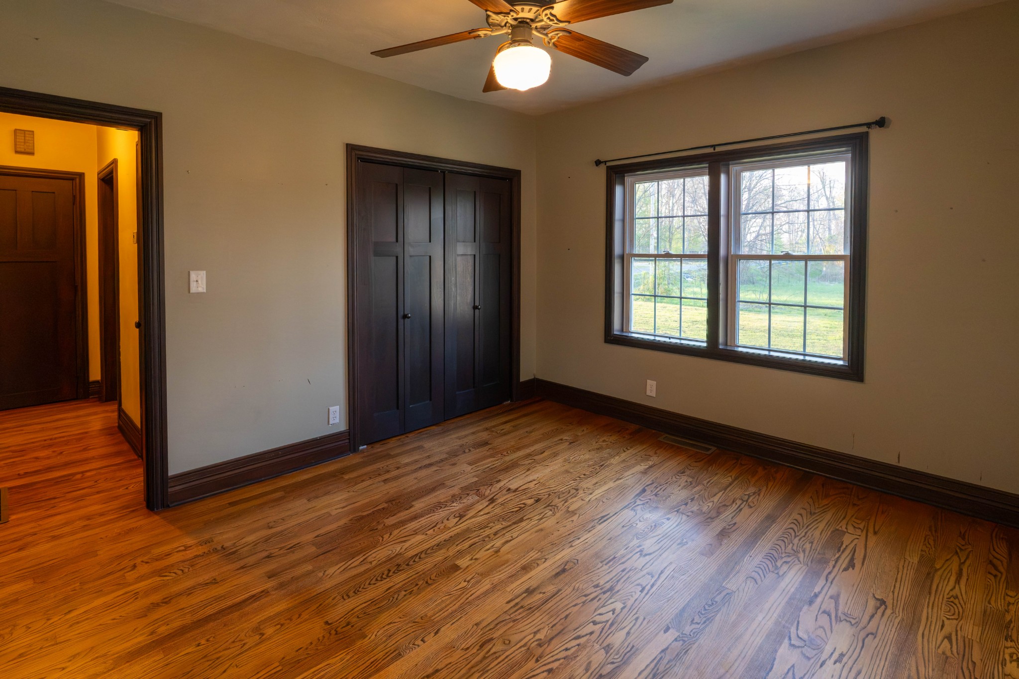 510 Rosebower Church Road Paducah, KY 42003 - Photo 26 of 52 a view of an empty room with wooden floor and a window