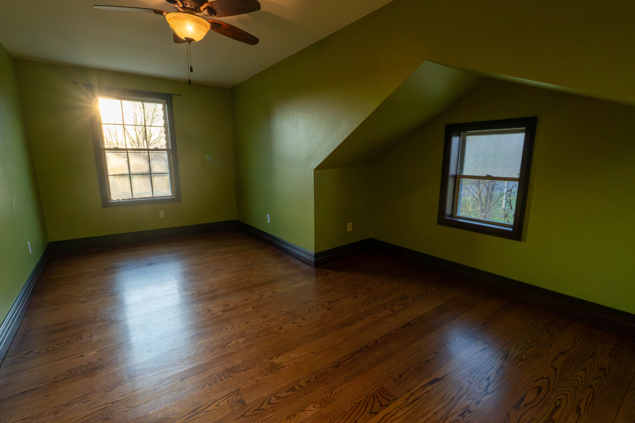 510 Rosebower Church Road Paducah, KY 42003 - Photo 28 of 52 an empty room with wooden floor and windows