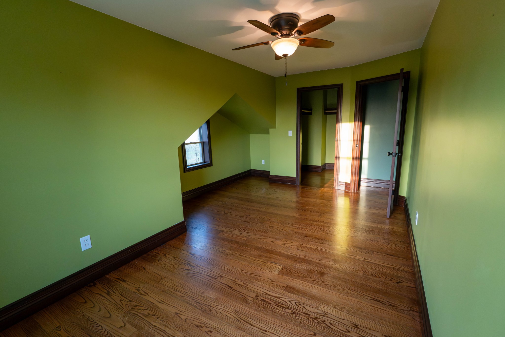510 Rosebower Church Road Paducah, KY 42003 - Photo 29 of 52 a view of an empty room with wooden floor and a window