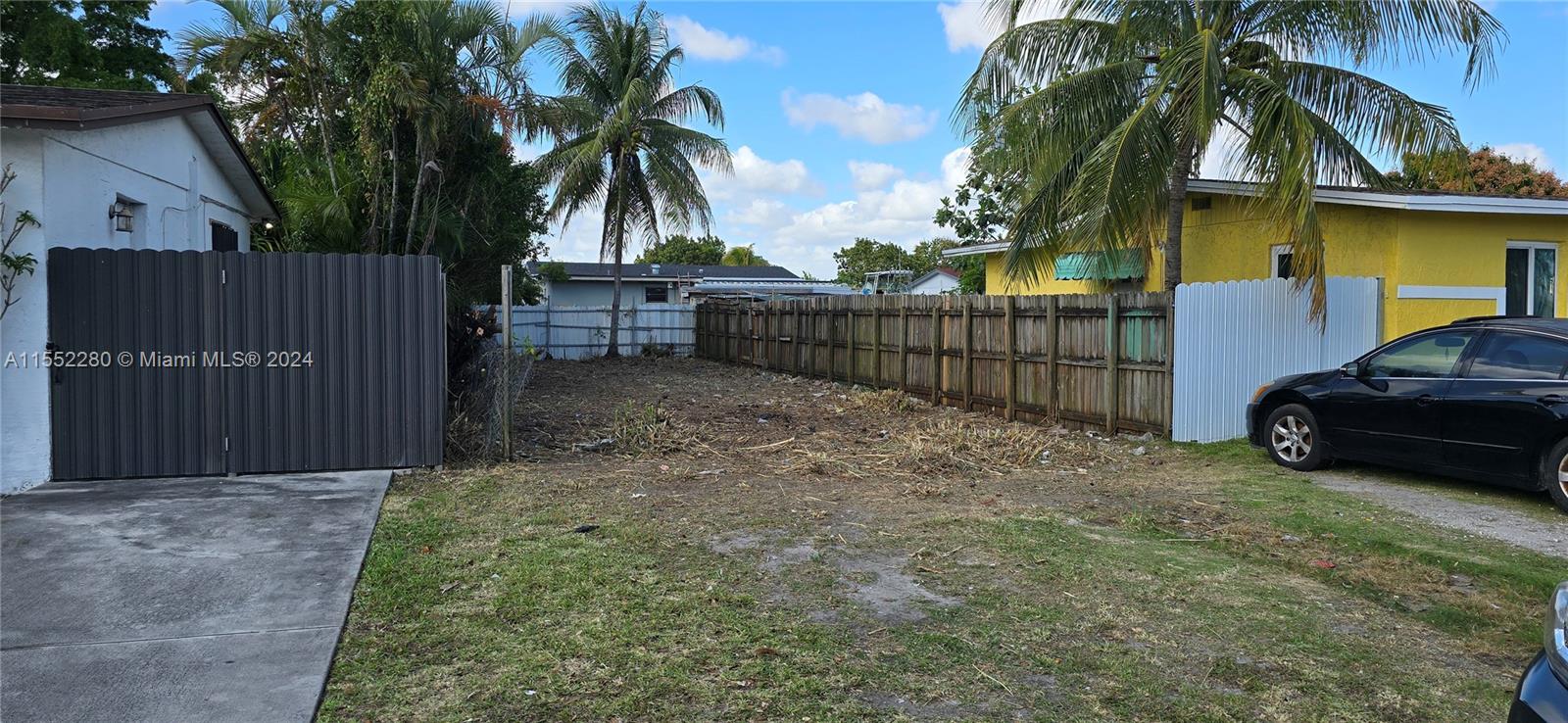 184 Eureka Miami, FL 33177 - Photo 12 of 13 a view of a house with a yard and furniture