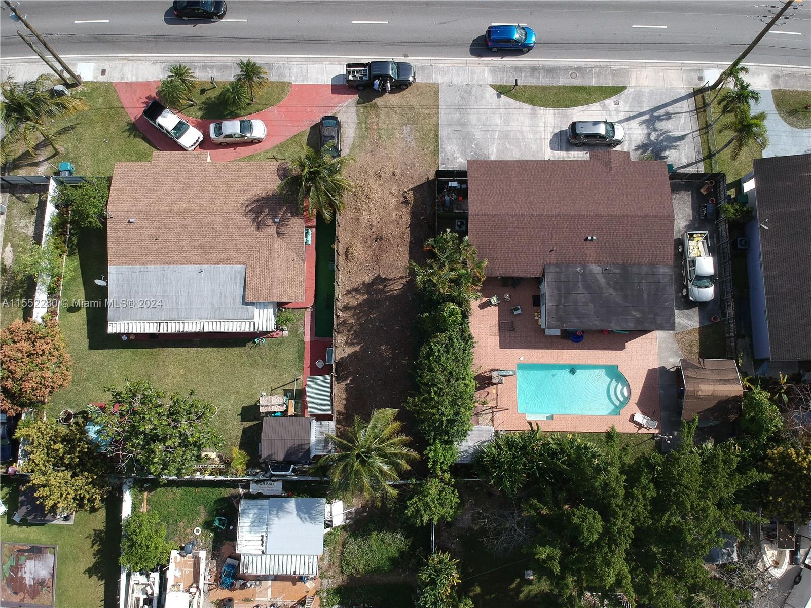 184 Eureka Miami, FL 33177 - Photo 9 of 13 an aerial view of a house with a yard and a fountain