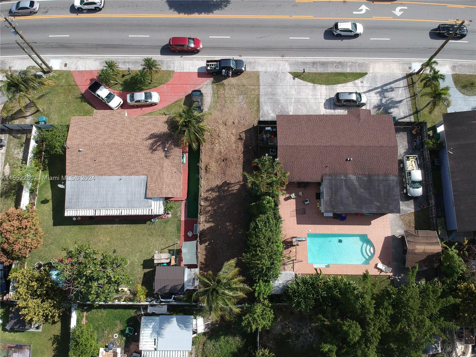 184 Eureka Miami, FL 33177 - Photo 10 of 13 an aerial view of a house with a yard and a fountain