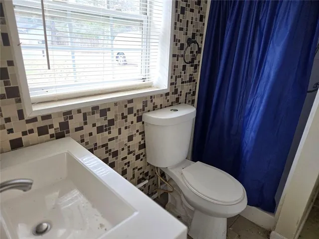 a bathroom with a sink and a toilet