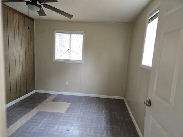 a view of room with window and hardwood floor