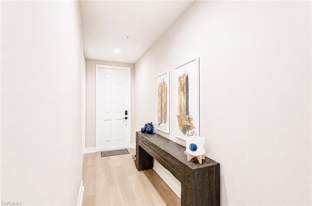 2620 Seychelles Circle, Unit 1302 Naples, FL 34112 - Photo 26 of 43 a room with a bed and a window