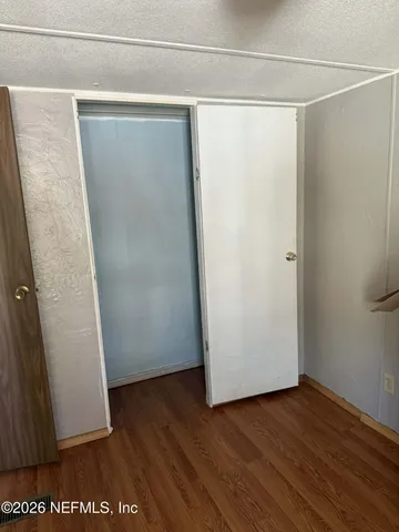 a view of a room with racks on the wall