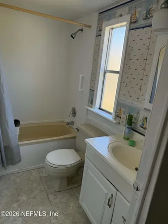 a bathroom with a glass door shower