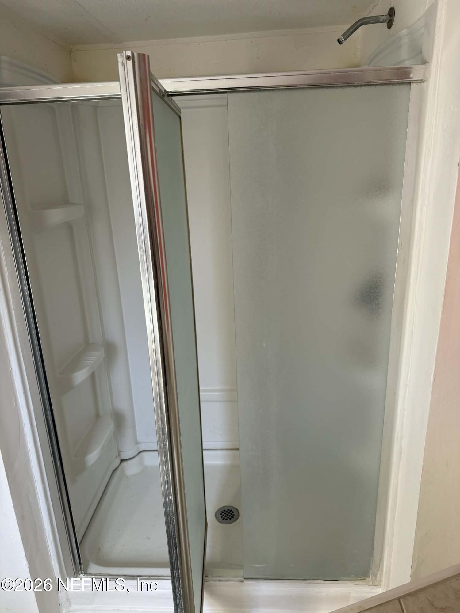 133 Sportsman Road Satsuma, FL 32189 - Photo 19 of 45 a bathroom with a glass door shower