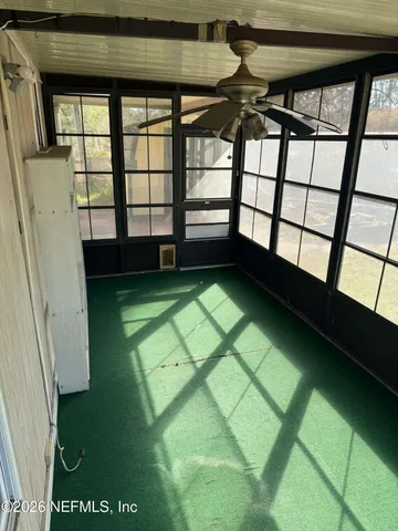 a view of a balcony with chairs