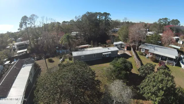 an aerial view of a house with outdoor space
