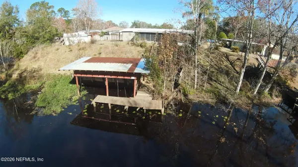 a view of a yard with trees